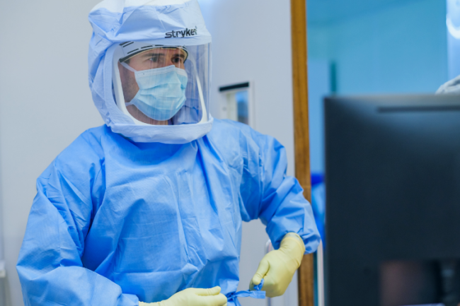 Mako Robotic Assisted Surgery Orthopaedic surgeon in Stryker suit preparing for joint replacement surgery