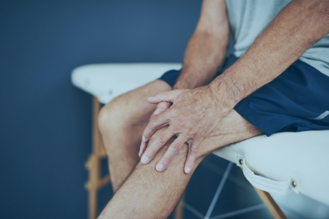 Man holding knee with OA