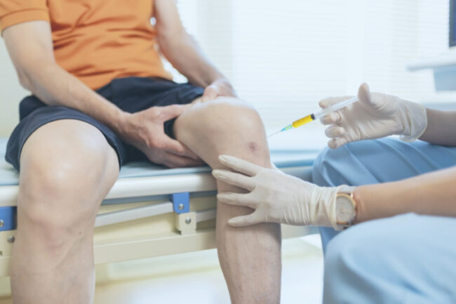 Patient having injection into knee