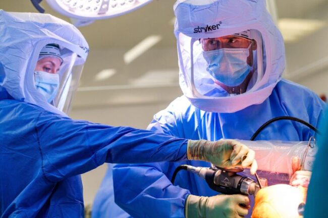 Mr Andrew Carrothers, orthopaedic surgeon in Cambridge, performing Mako robotic assisted partial knee replacement surgery
