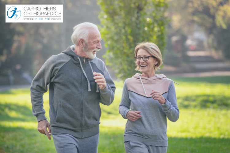 Middle aged couple jogging in the park
