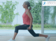 Middle age woman doing lunges with small hand weights