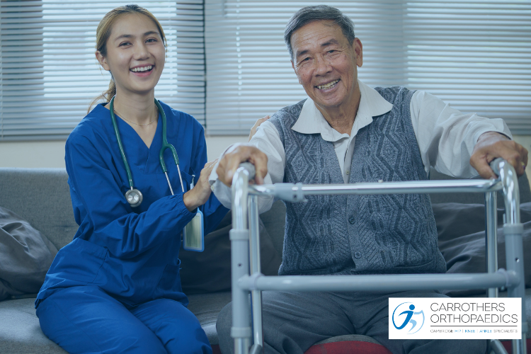 Happy man with a walker at home having a nurse visit