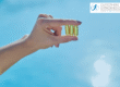 Hand holding vitamin D capsules to the sun