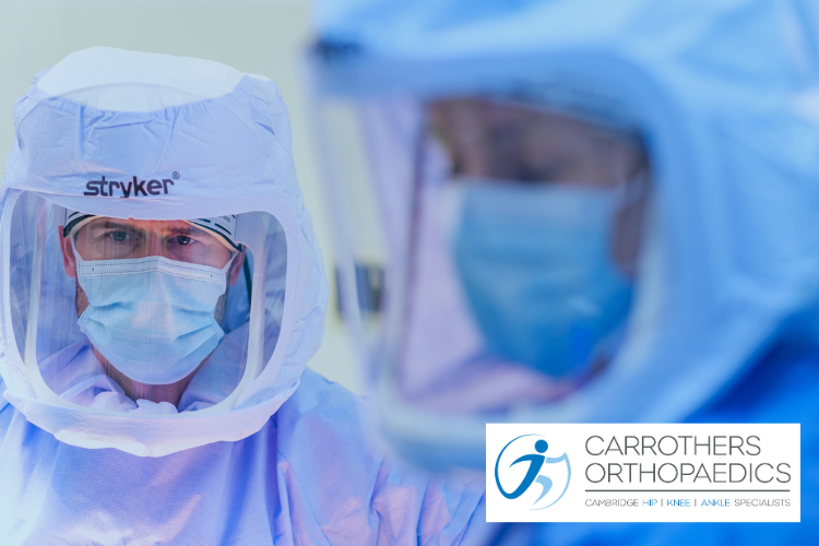 Andrew Carrothers in Stryker scrubs performing Mako robotic arm assisted joint replacement at Spire Healthcare in Cambridge